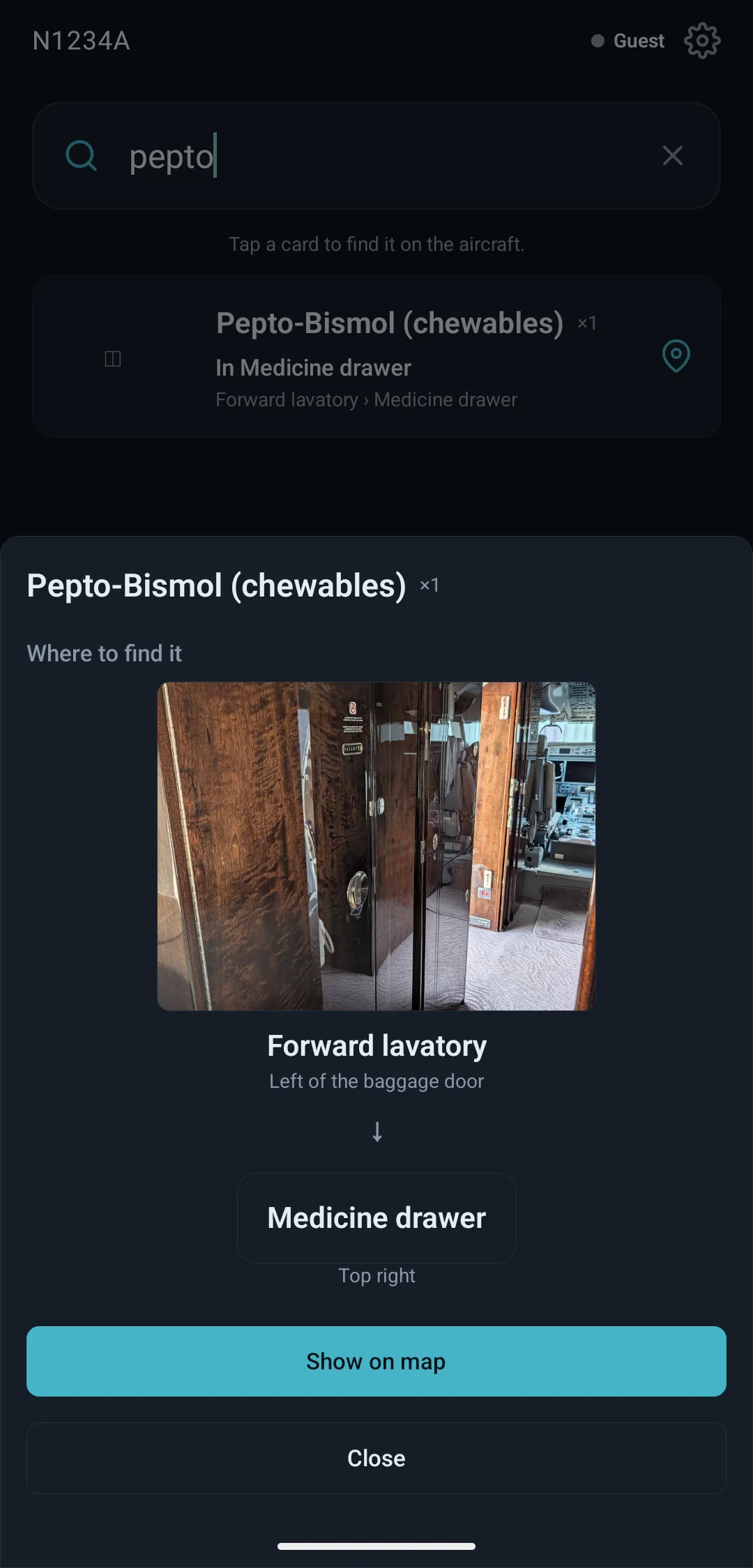 Passenger Mode on a phone: a search for “pepto” finds Pepto-Bismol, and “Where to find it” shows a photo of the Forward lavatory, then the Medicine drawer, top right.